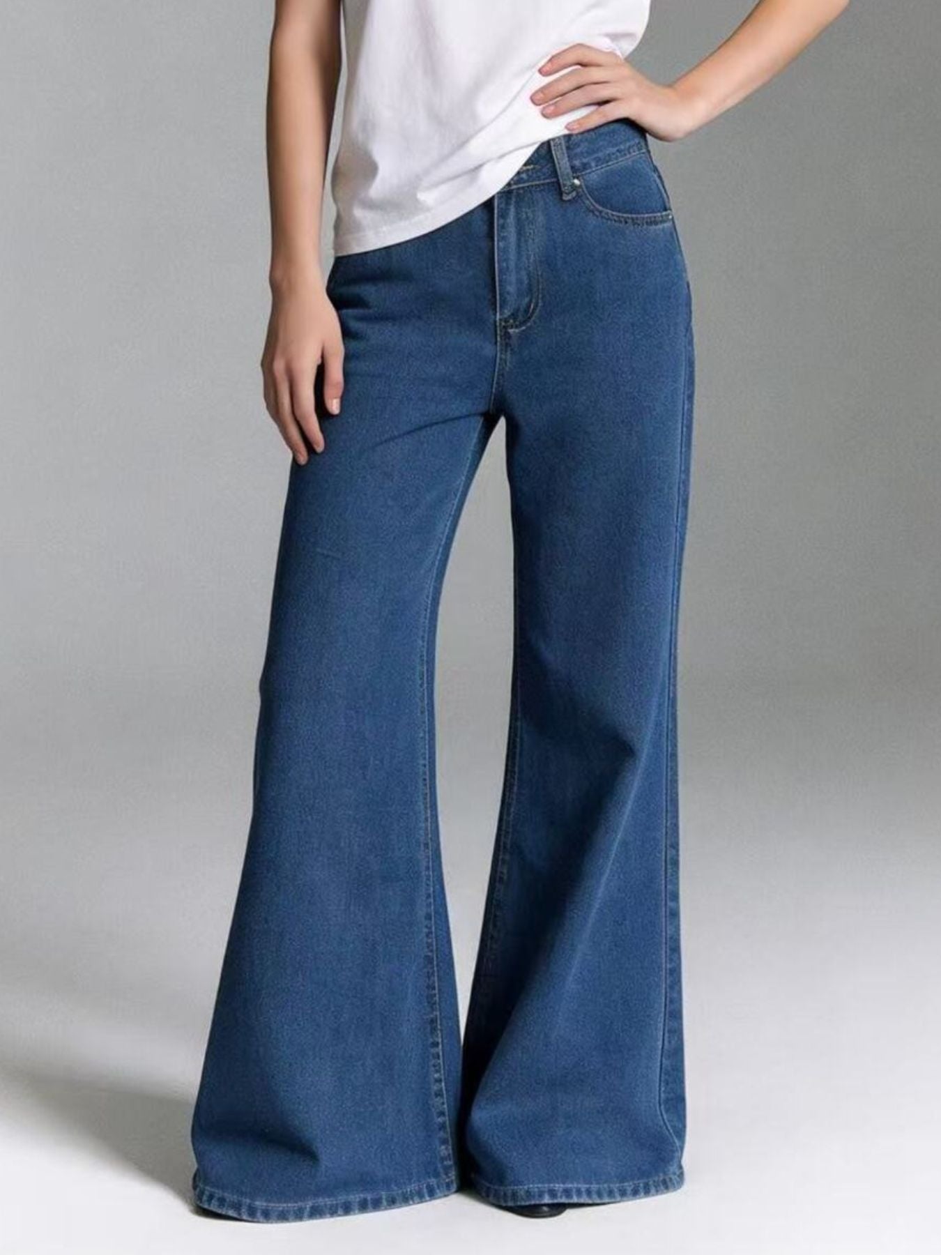 Maternity high-waisted flare jeans in blue denim, featuring a dramatic wide leg and comfortable fit.
