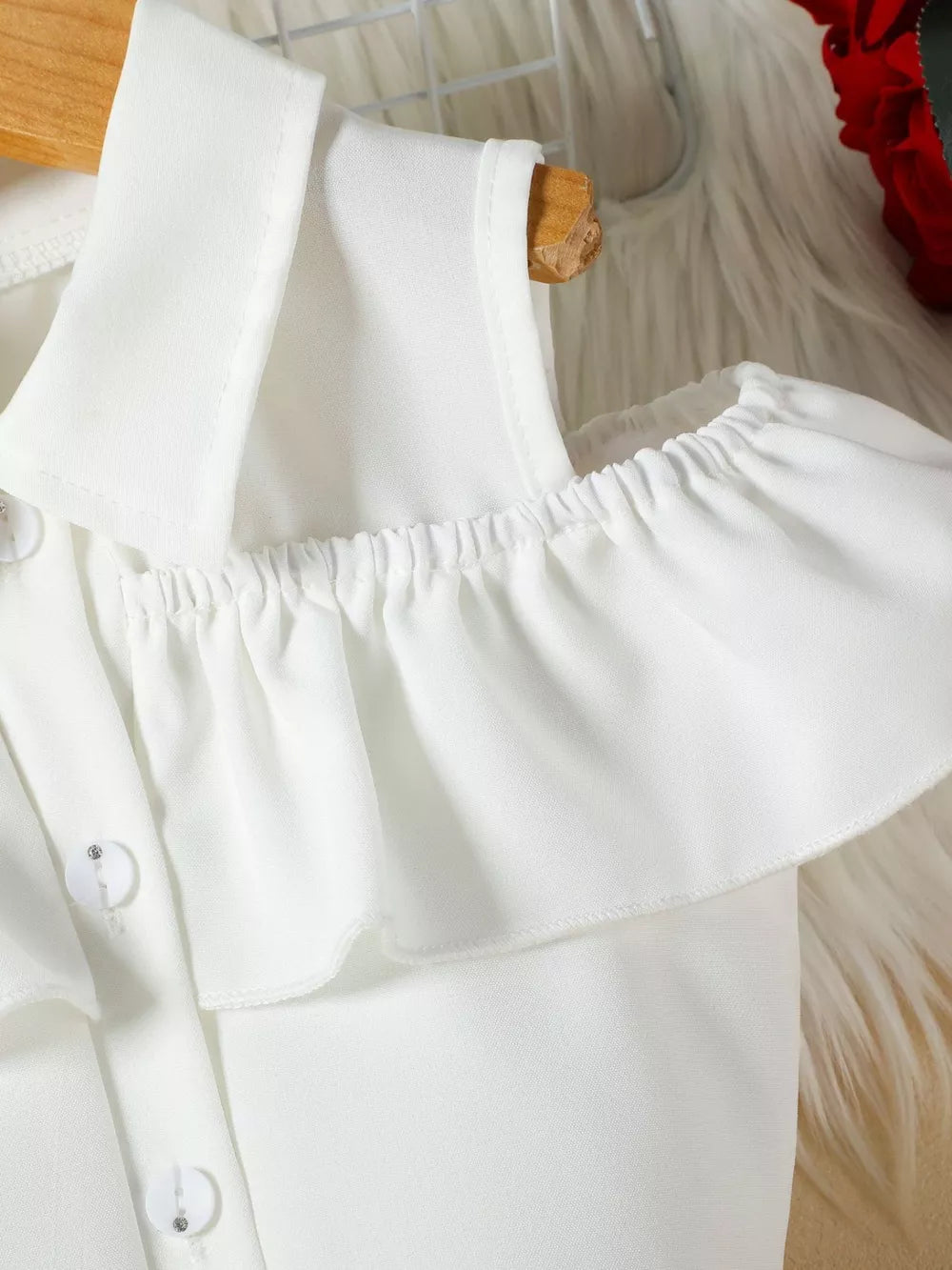 White toddler ruffled cold-shoulder top with button details