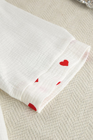 White gauze pajama set with red heart print detail