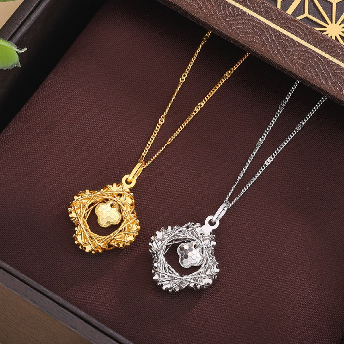 Charming clover pendant necklaces in silver and gold with delicate chains.