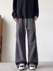 Plus-size dark gray herringbone drawstring sweatpants with wide legs.