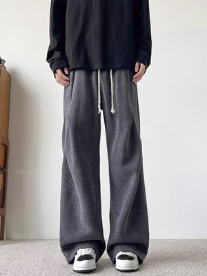 Plus-size dark gray herringbone drawstring sweatpants with wide legs.