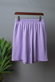 Lavender relaxed fit shorts with elastic waistband and side pockets.