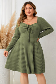 Matcha green ribbed fit-and-flare midi dress with tie-front and square neckline.