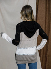Colorblock eyelet knit hoodie with black, beige, white, and grey stripes.