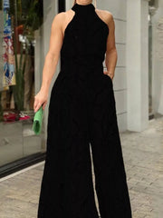 Black abstract print halter neck wide leg romper with pockets