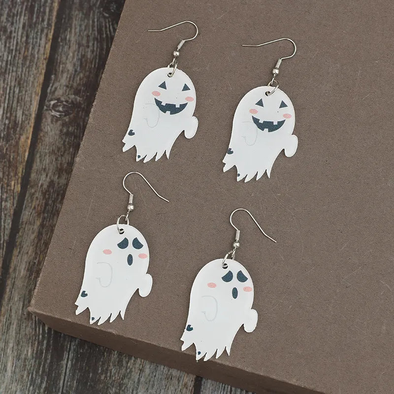 White acrylic dangle earrings with spooky ghost designs and alloy hooks.
