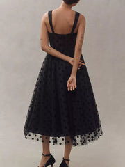 Black polka dot tulle dress with sweetheart neckline and spaghetti straps.