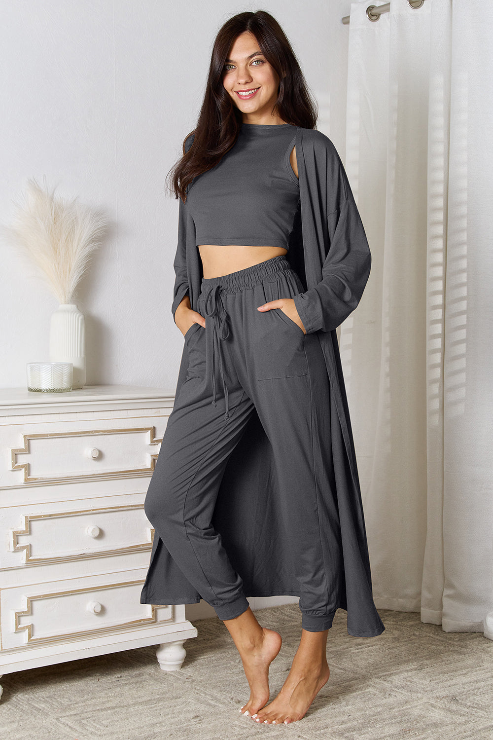 Dark gray loungewear set with crop top, long cardigan, and drawstring pants.