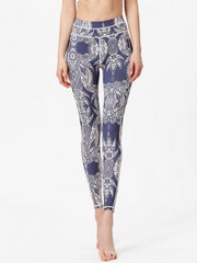 Navy cosmic print contour leggings with white piping and a full-length cut.