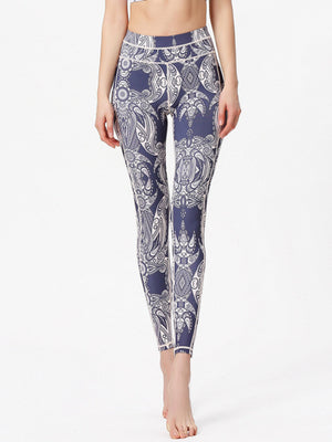 Navy cosmic print contour leggings with white piping and a full-length cut.