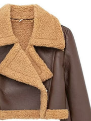 Brown cropped aviator jacket with shearling trim and collar detail.