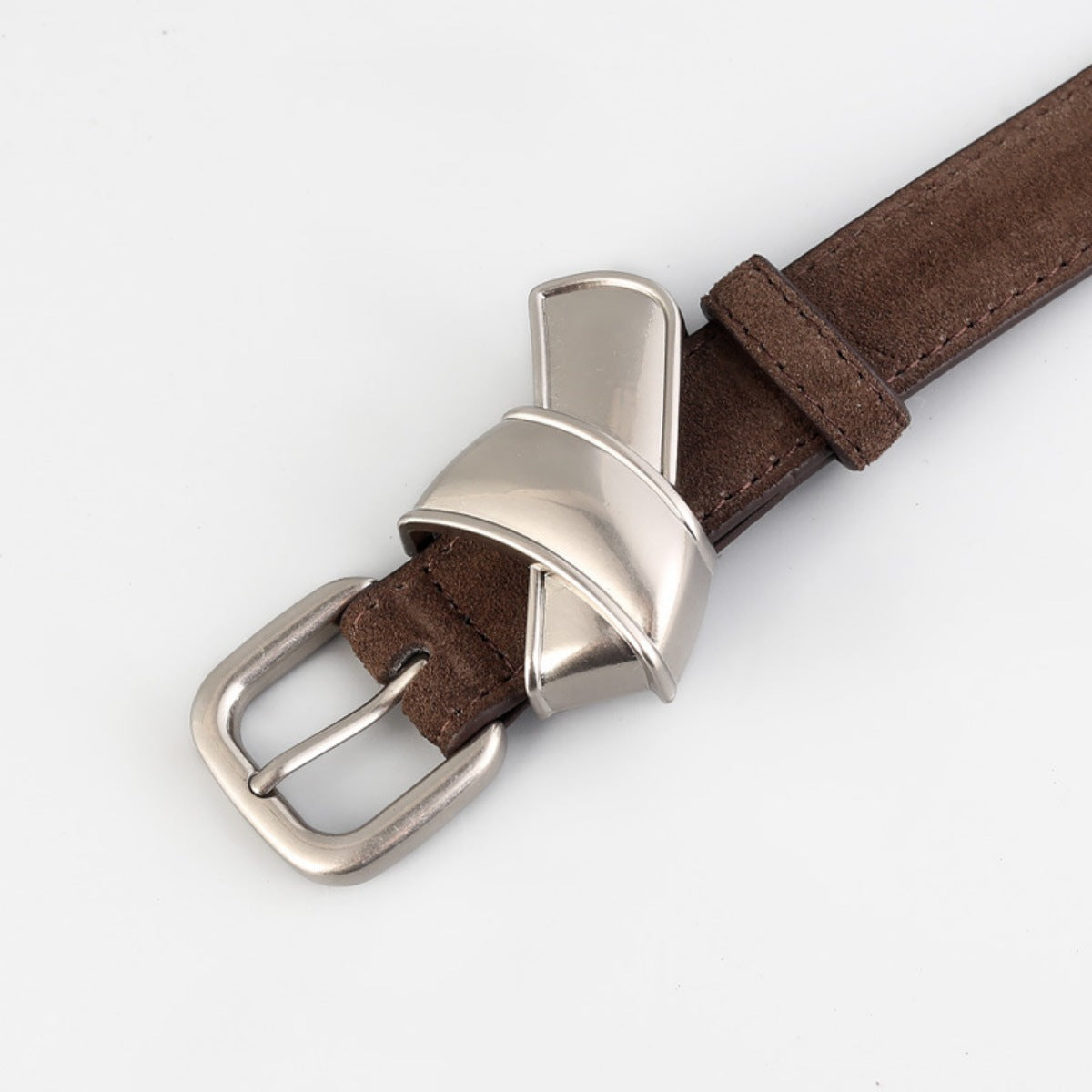 Brown leather belt with sculptural silver buckle and silver buckle closure