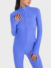 Cobalt blue ribbed performance zip-up jacket with thumbholes and a zippered pocket.