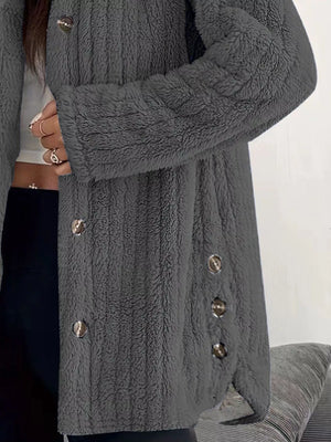 Dark grey button-up fleece jacket with textured fabric and silver buttons.