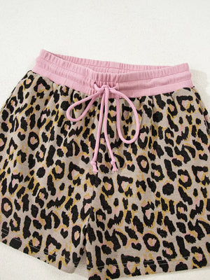 Leopard print lounge shorts with pink drawstring and elastic waistband.