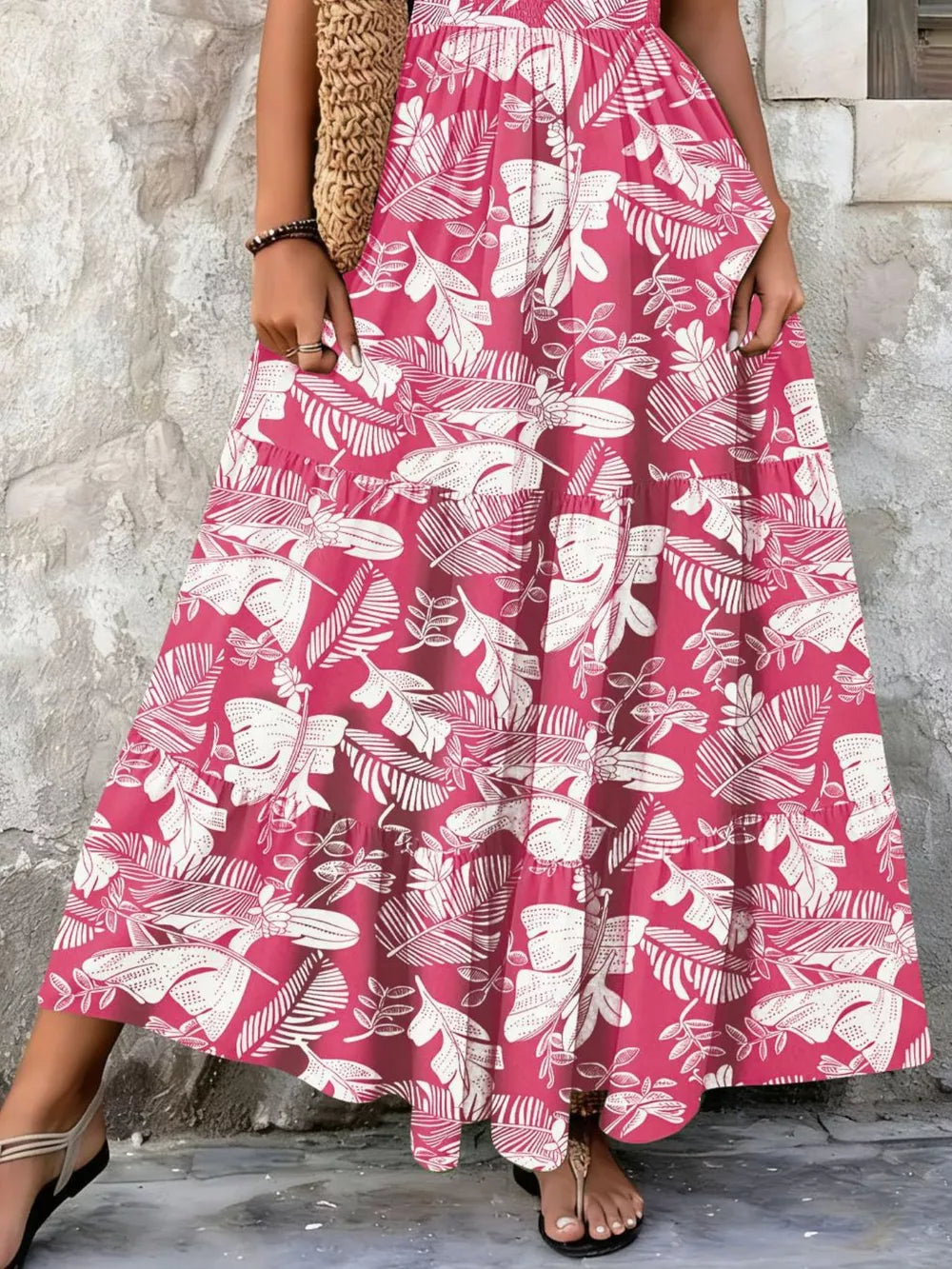 Maxi dress in Strawberry with white leaf print, tiered skirt, and smocked bodice detail.