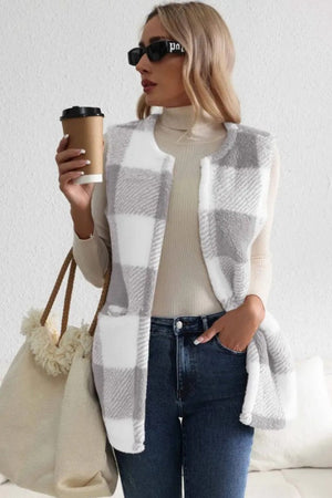 Oversized sherpa gilet in light gray buffalo check with a relaxed fit and pockets.