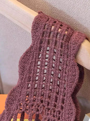 Crochet floral overlay tank top in deep purple with open knit pattern and scalloped hem.