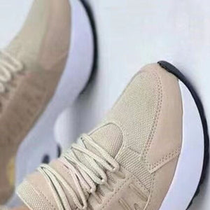 Khaki lace-up chunky platform sneakers with white soles and black trim.
