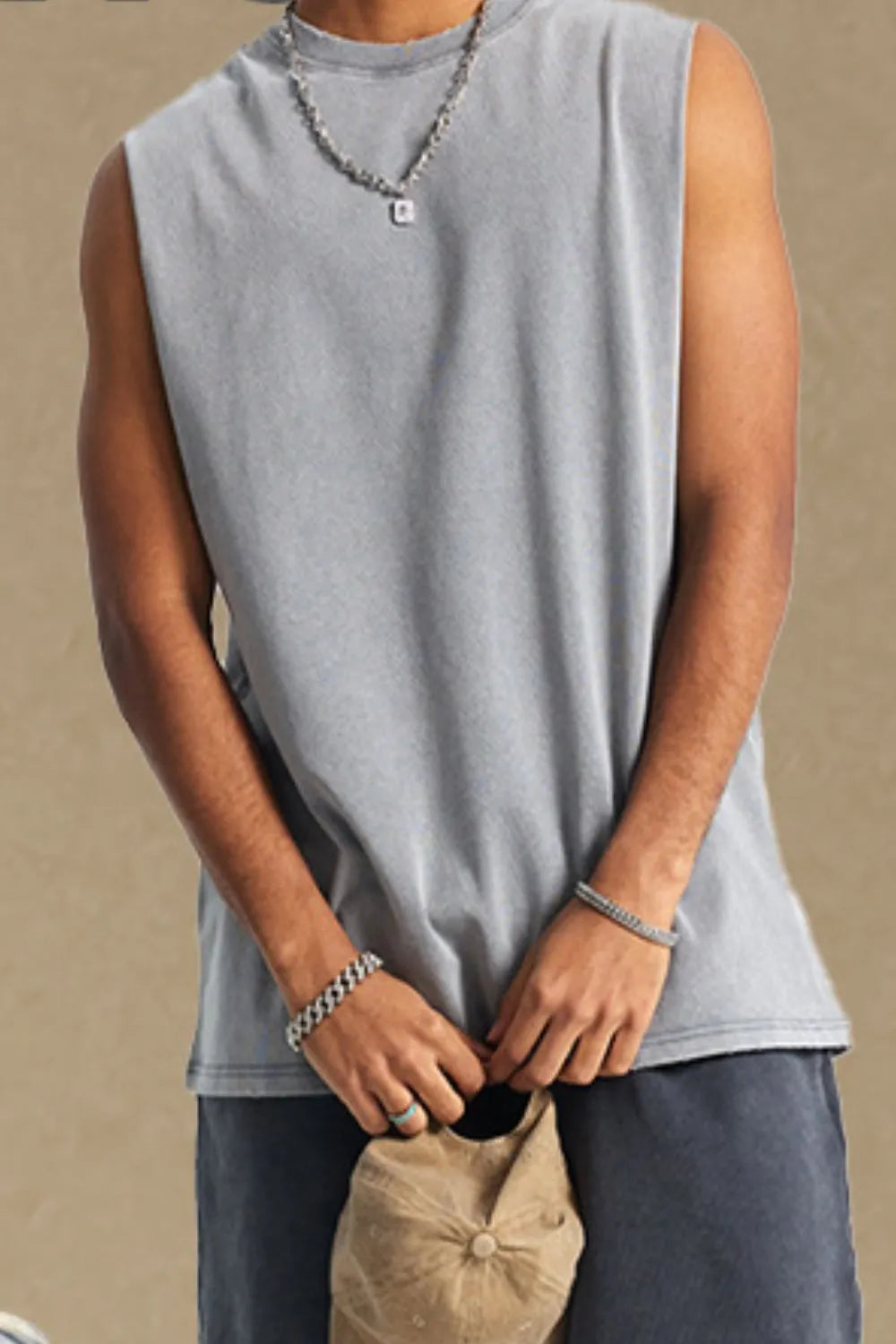 Washed cotton muscle tank in gray with a crew neck and relaxed fit.