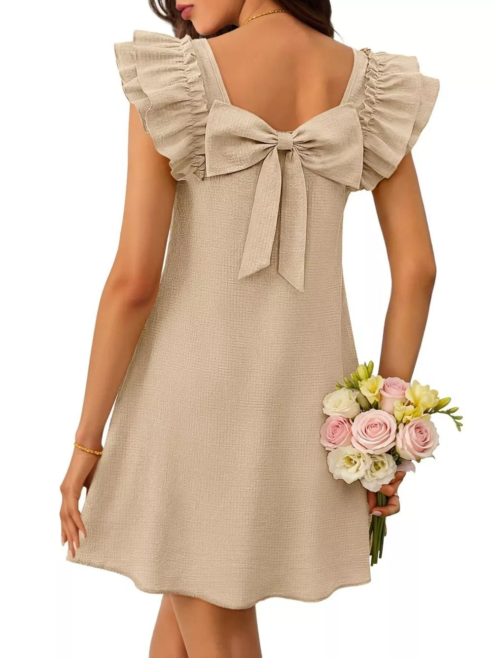 Apricot a-line dress with ruffled cap sleeves and a large back bow.