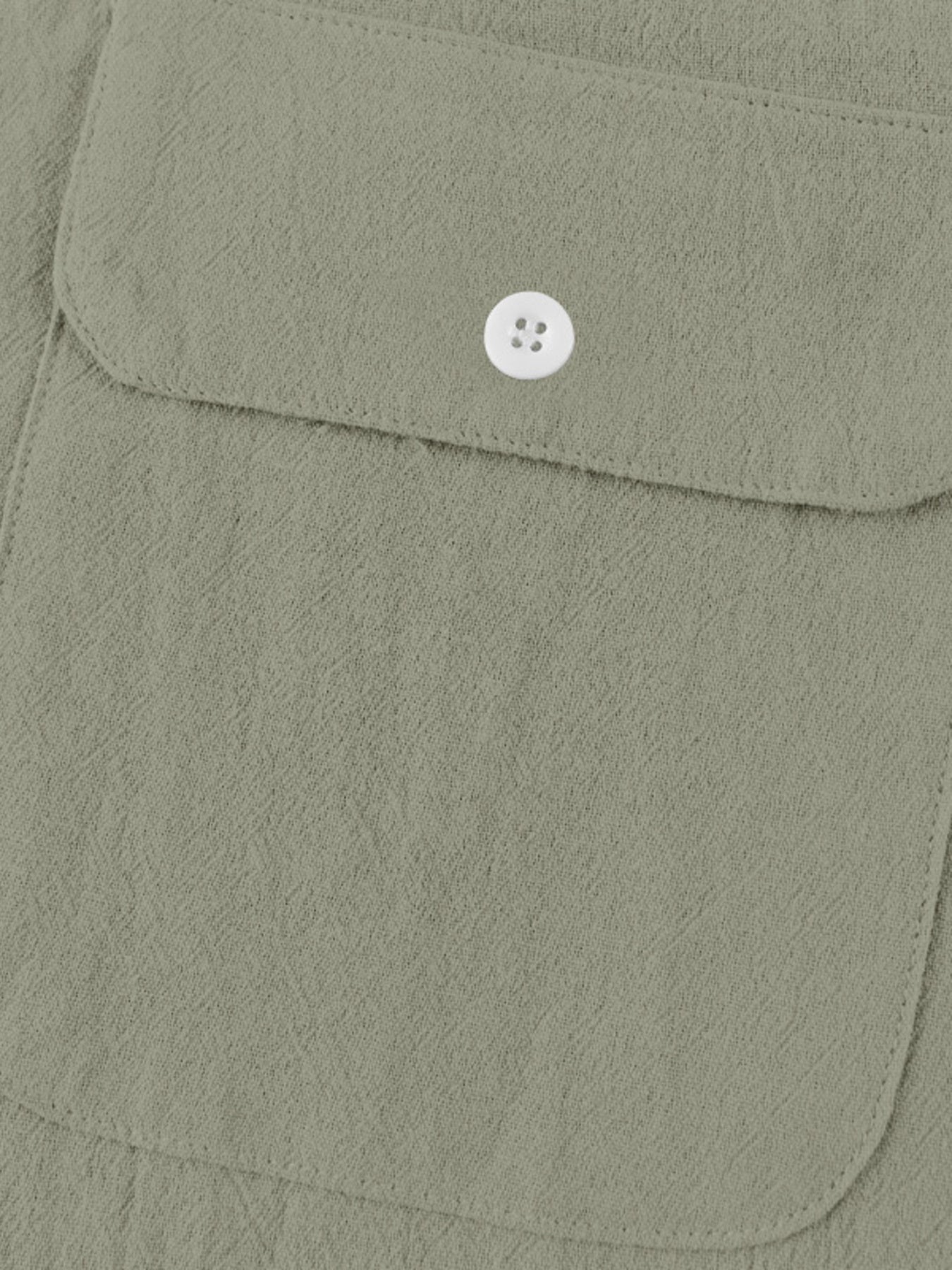 Military green cotton henley shirt with button-flap chest pocket detail.