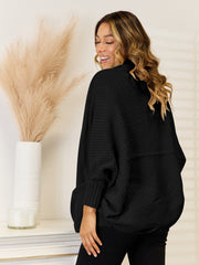 Black cocoon knit cardigan with waffle texture and pockets, acrylic material.