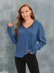 Dusty Blue waffle knit hoodie with V-neck and drawstring, relaxed fit, long sleeves.