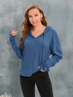Dusty Blue waffle knit hoodie with V-neck and drawstring, relaxed fit, long sleeves.