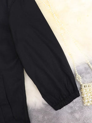 Black midi dress with cuffed sleeves and tie waist detail.