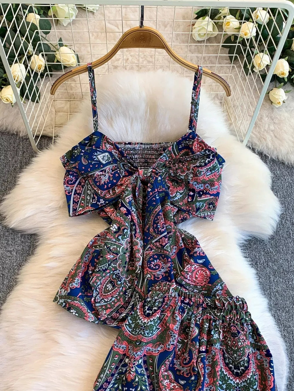 Chic cami and wide-leg pant set in Royal Blue paisley print with smocked bodice and tie detail.