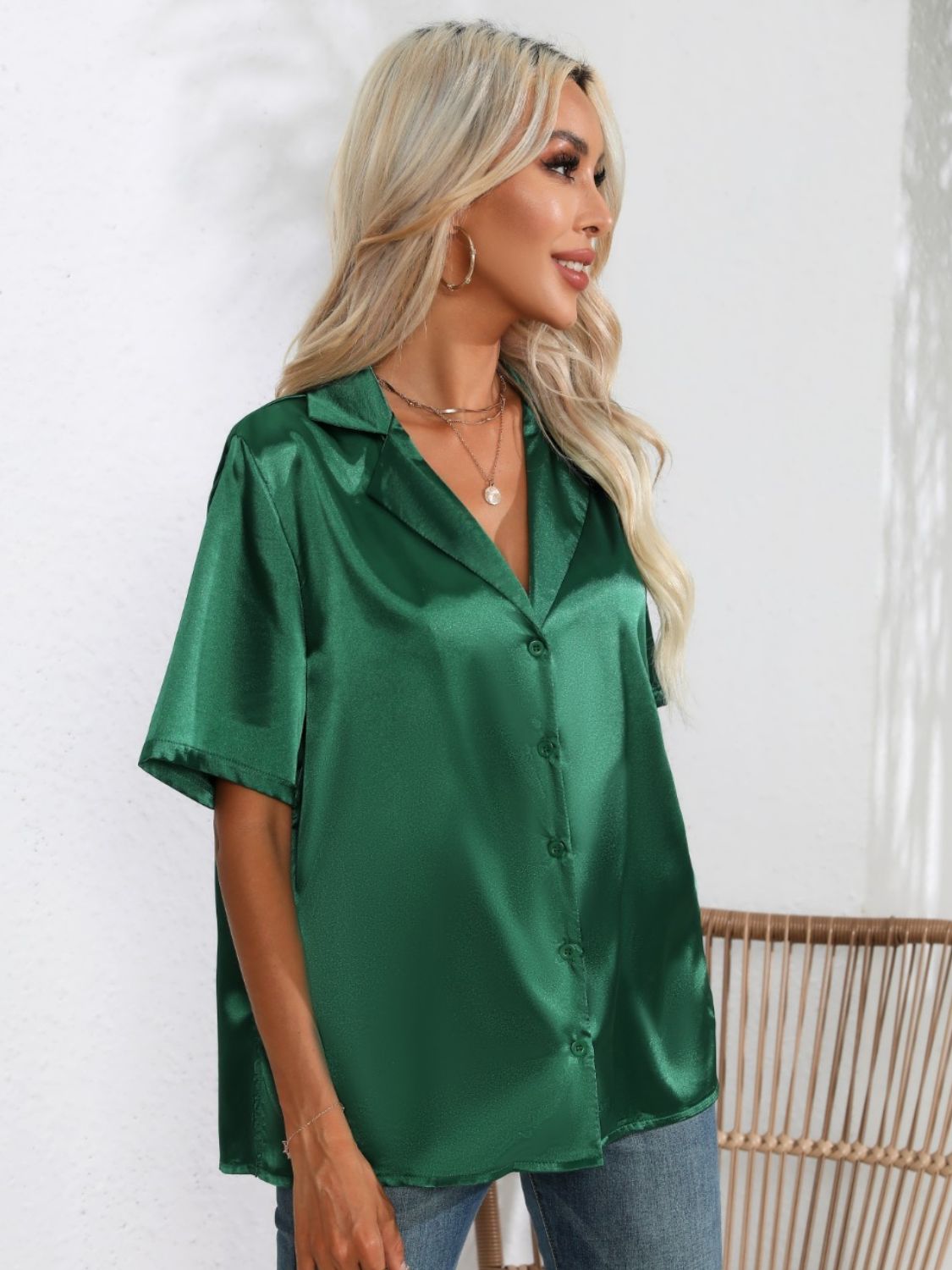 Dark green satin tie-front collared shirt with short sleeves and button front.