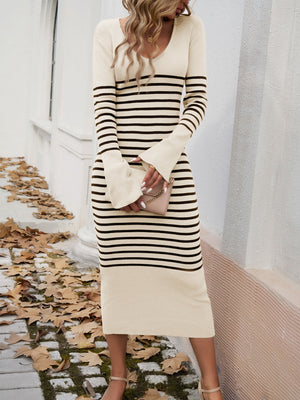 Striped knit midi dress in ivory with black stripes, V-neck, long flared sleeves, and bodycon fit.