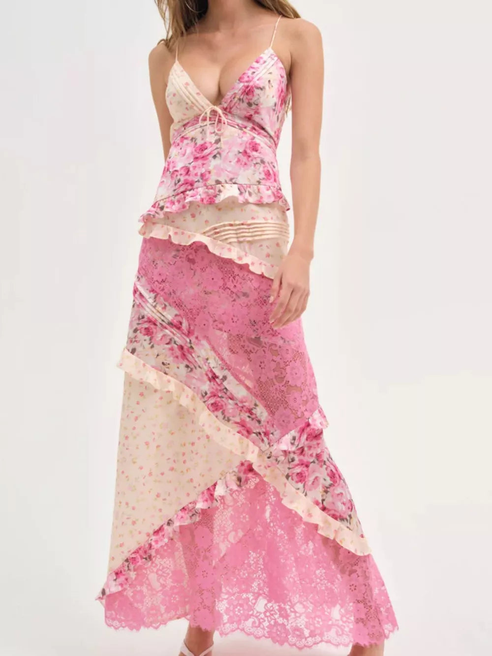 Maxi dress with floral print, lace tiers, and ruffled trim.