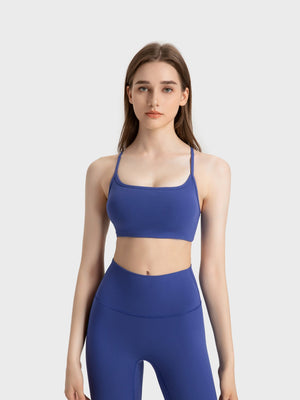 Strappy back active crop top in blue with a square neckline.