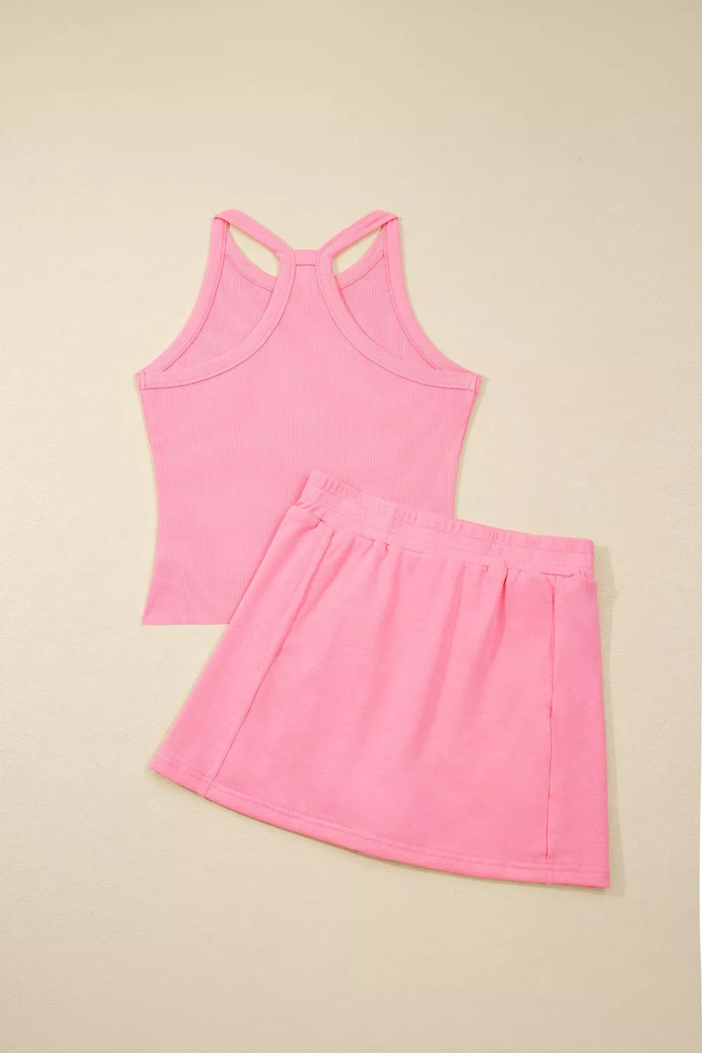 Pink ribbed cropped tank top and pocketed skort set
