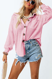 Blush pink waffle knit button-down shirt jacket with a collared neckline and button closure.