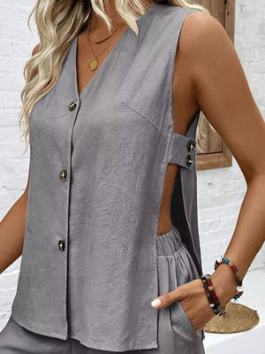 Dark gray V-neck buttoned sleeveless cutout set with textured fabric and elastic waist shorts.