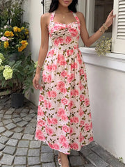 Romantic floral halter midi dress with a-line cut and tie-front bodice.