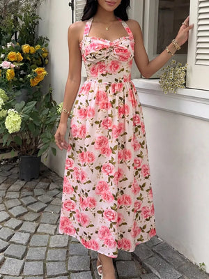 Romantic floral halter midi dress with a-line cut and tie-front bodice.