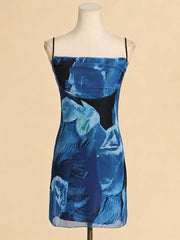 Blue abstract print spaghetti strap bodycon dress with a ruched bodice.