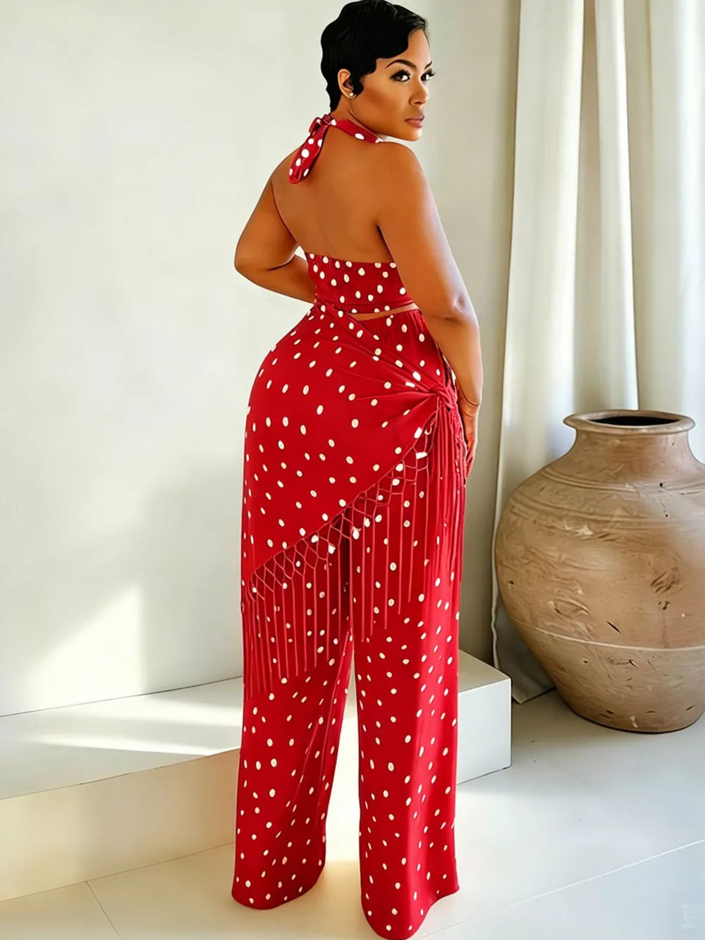 Red polka dot cami and fringe wide leg pant set with halter neckline.