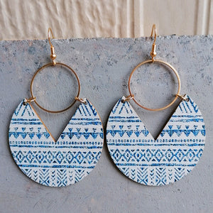 Geometric wood drop earrings with blue tribal pattern and gold hoops