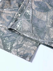 Men's camouflage cargo sweatpants with a grey and green leaf pattern.