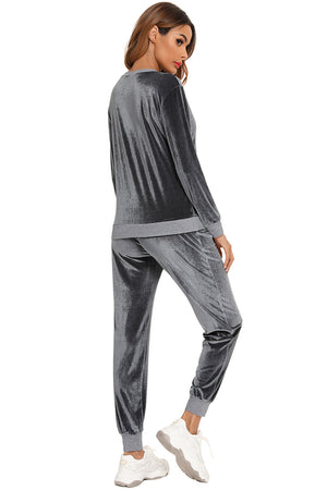 Velvet lounge set in charcoal with contrast trim on the waistband and cuffs.