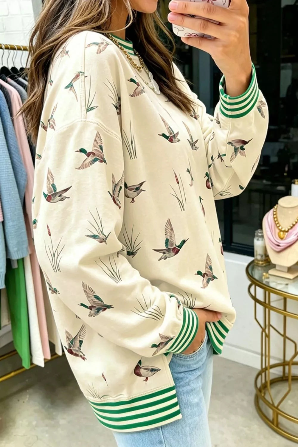 Whimsical Duck Print Sweatshirt in Beige, side view