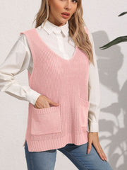 Oversized dusty pink knit vest with V-neck and patch pockets, styled over a white shirt.