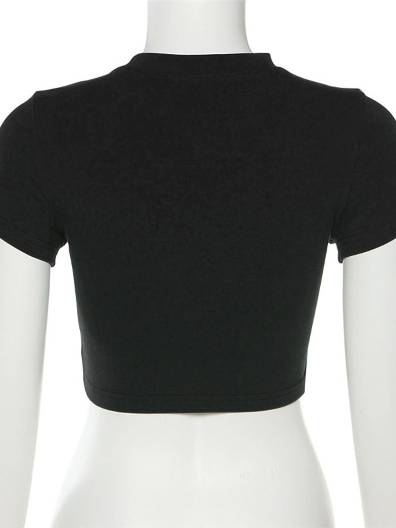 Black cropped t-shirt with crew neck and short sleeves.