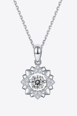 Silver diamond halo necklace with heart details on a sterling silver chain.
